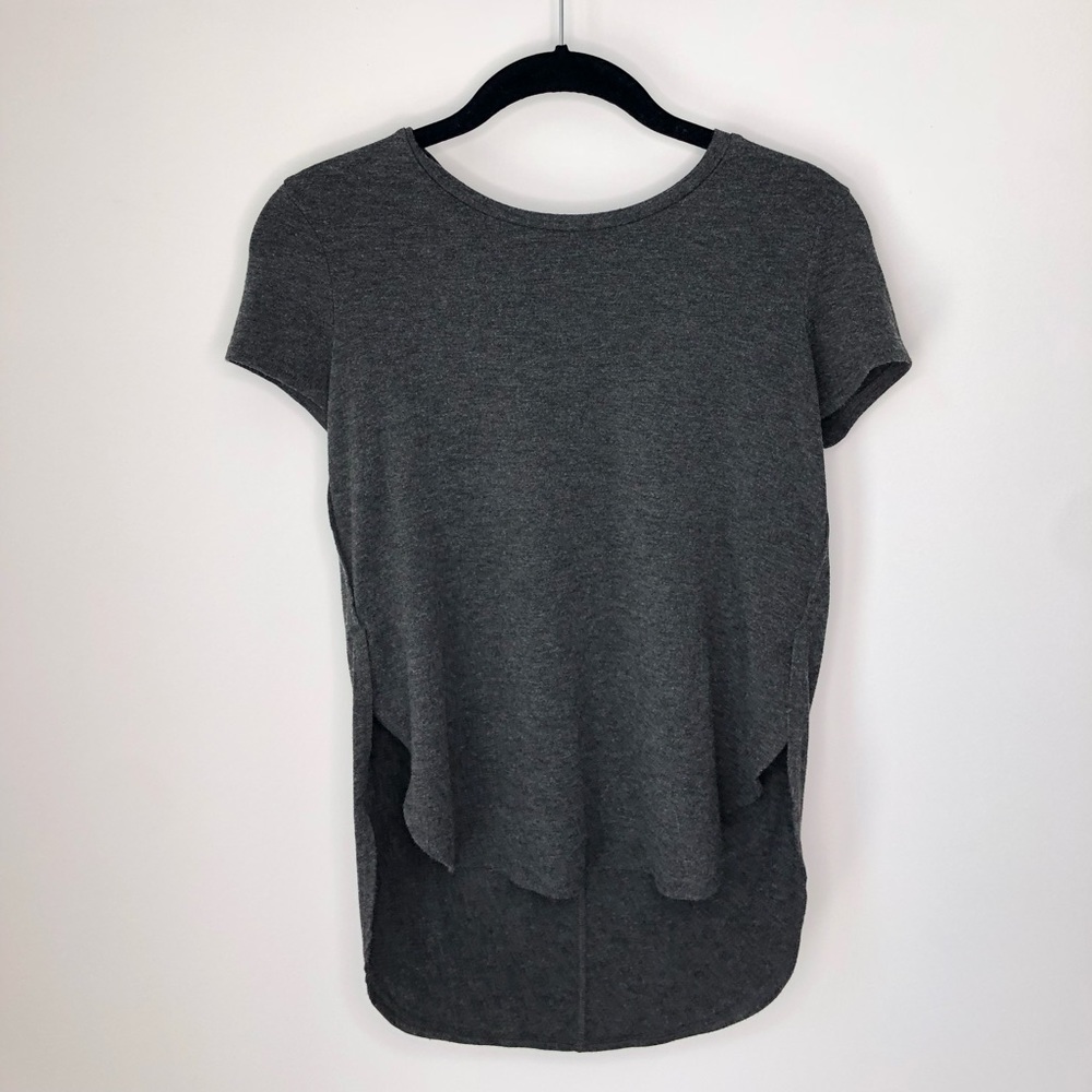 Gray shirt. Higher in front- lower in back